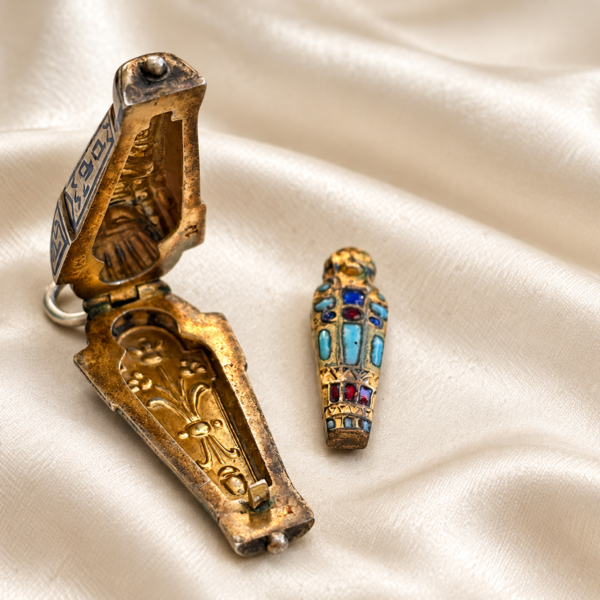 antique Egyptian Revival silver sarcophagus charm open to reveal mummy figure