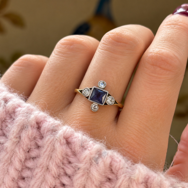 antique Art Deco cardinal point sapphire and diamond ring in 18ct yellow gold and platinum for sale in Leeds, shown on model's hand