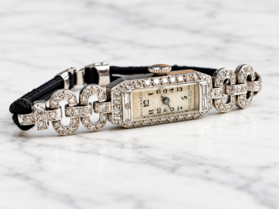 antique Art Deco diamond watch in 9ct white gold, displayed on marble