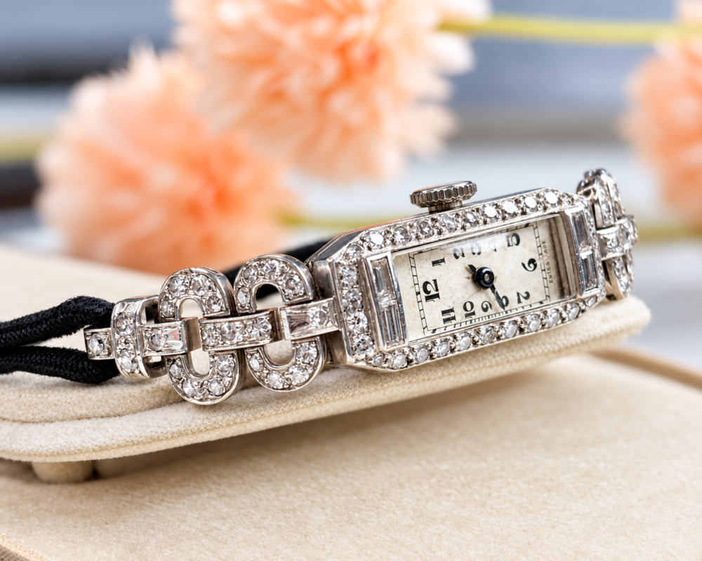 antique Art Deco diamond watch in 9ct white gold, shown in an antique display box