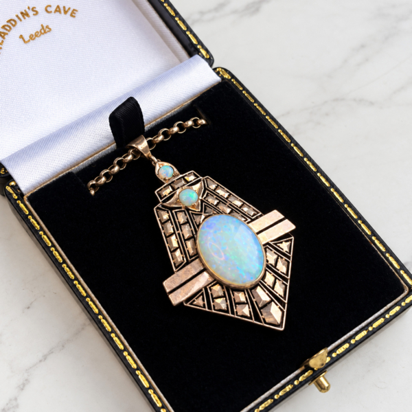 antique 1920s Egyptian Revival opal necklace, shown in a black box