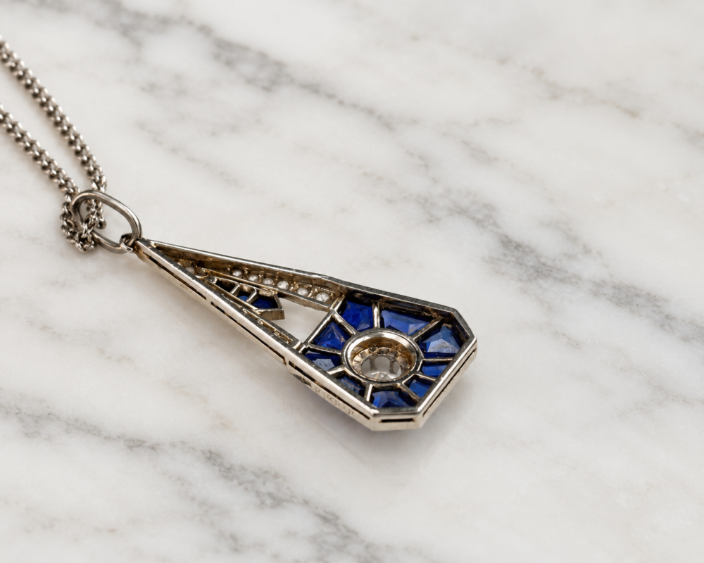 antique Art Deco sapphire and diamond pendant in 18ct white gold with French hallmarks. For sale in Leeds. Showing the back of the pendant