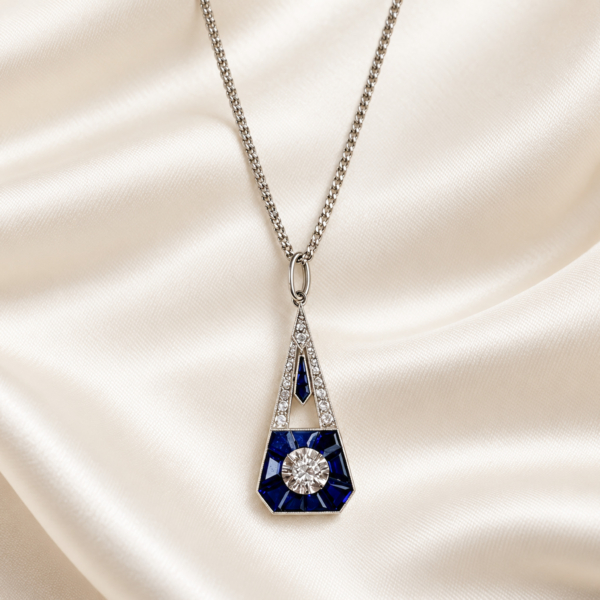antique Art Deco sapphire and diamond pendant in 18ct white gold with French hallmarks. For sale in Leeds.