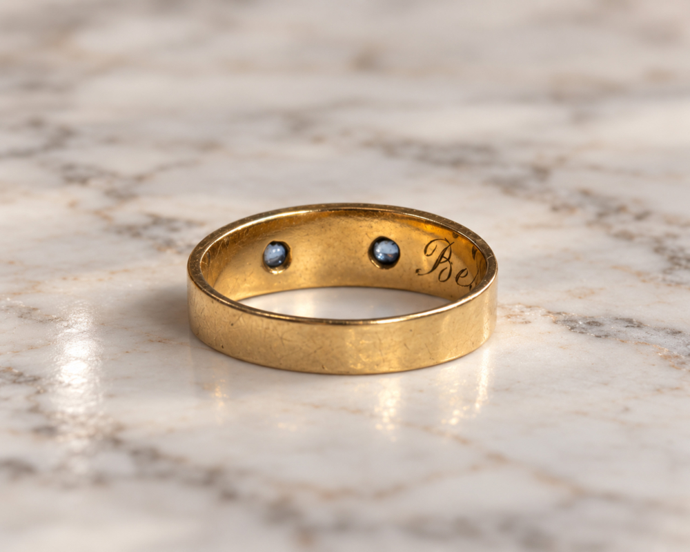antique Edwardian era sapphire and seed pearl ring in 18ct gold and dated 1904, showing reverse of the ring