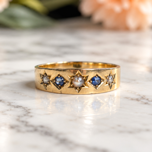 antique Edwardian era sapphire and seed pearl ring in 18ct gold and dated 1904