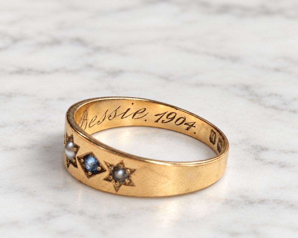 antique Edwardian era sapphire and seed pearl ring in 18ct gold and dated 1904, showing inscription to Bessie