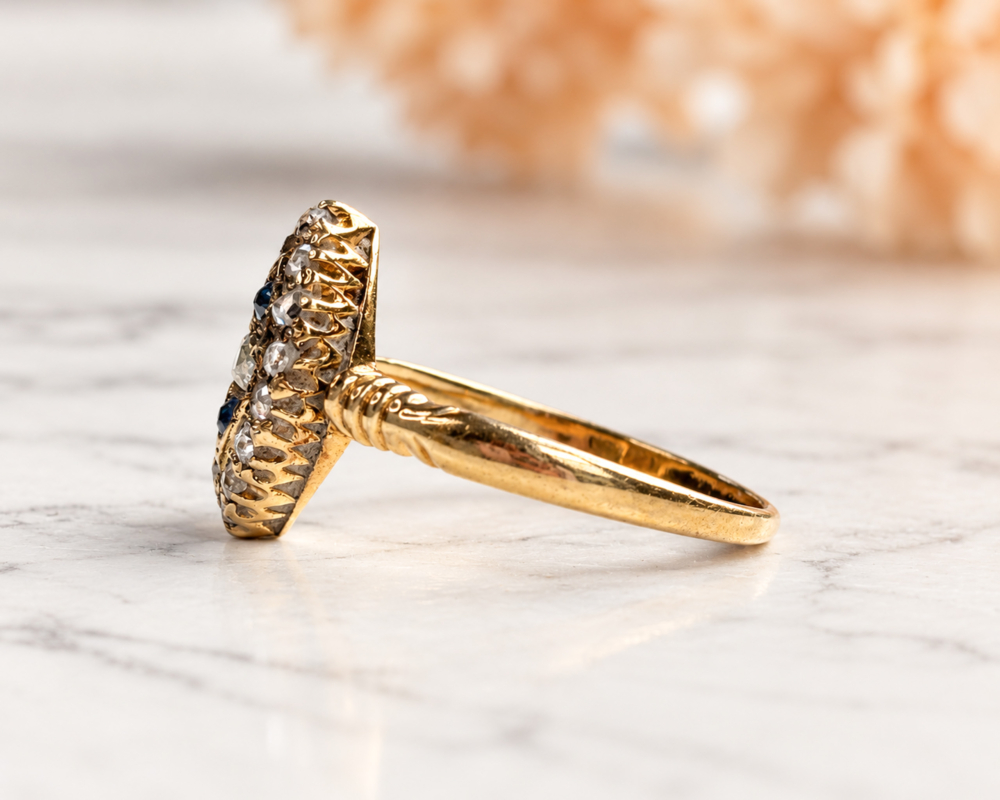 antique Victorian sapphire and old cut diamond navette ring in gold for sale in Leeds, showing the side profile of the ring
