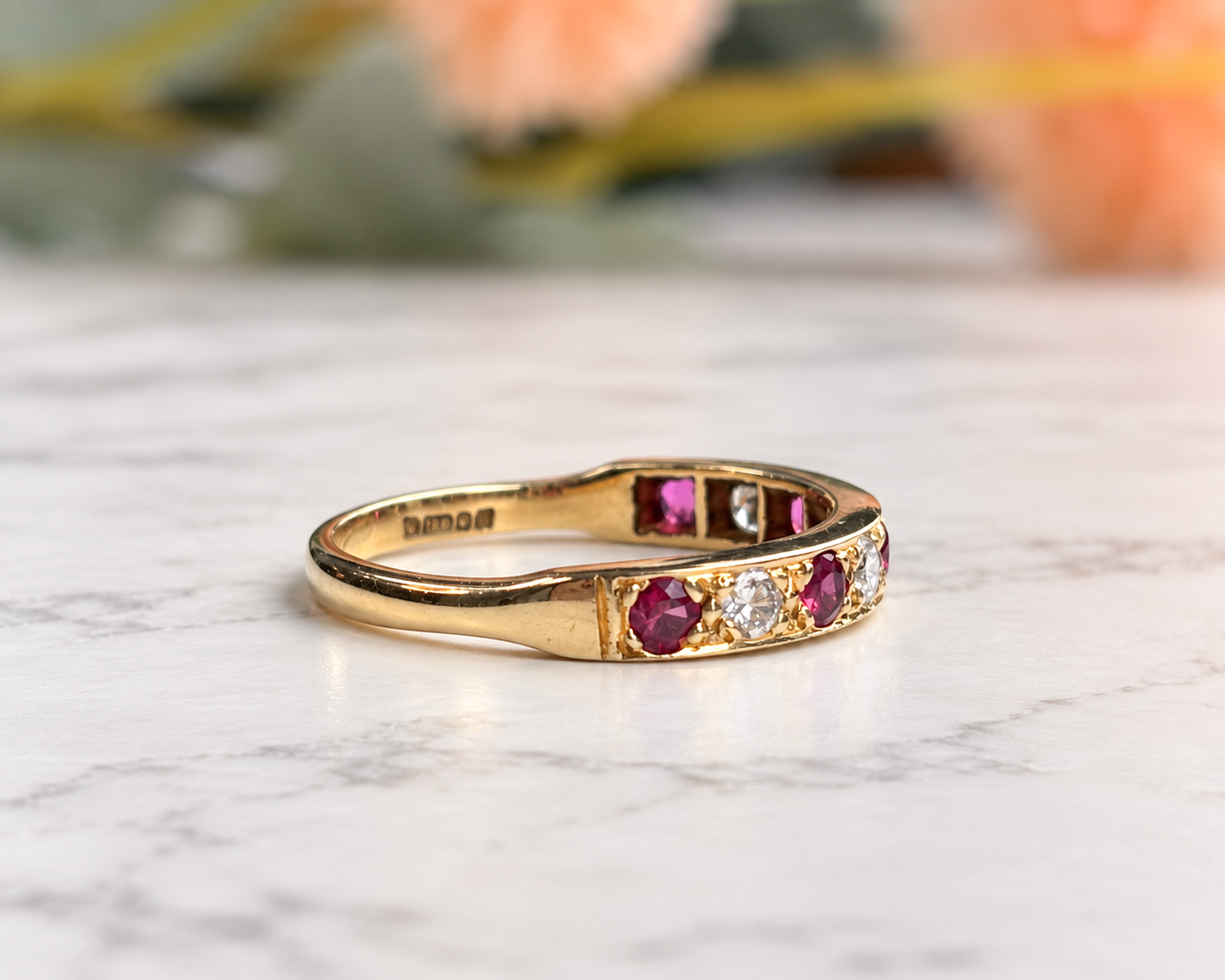 Ruby and Diamond Gold Ring on Marble