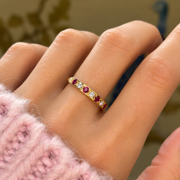 vintage ruby and diamond half eternity ring in 18ct yellow gold for sale in Leeds on a hand