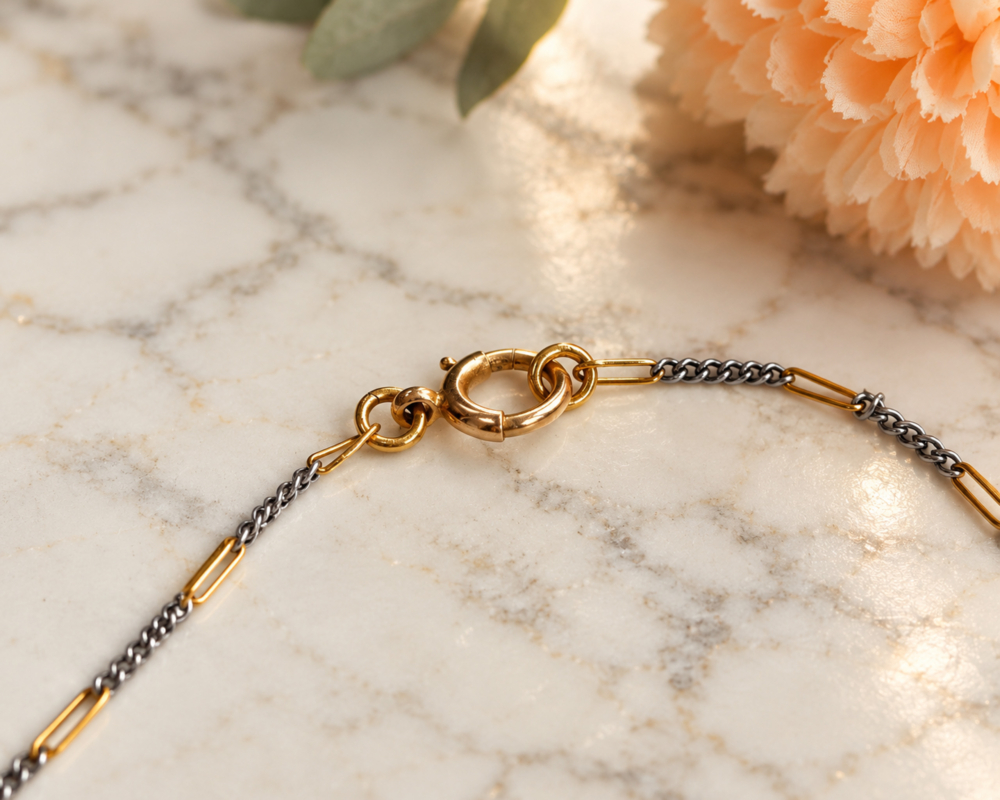 antique Edwardian era diamond pendant on a mixed metal chain for sale in Leeds, showing the chain fastening