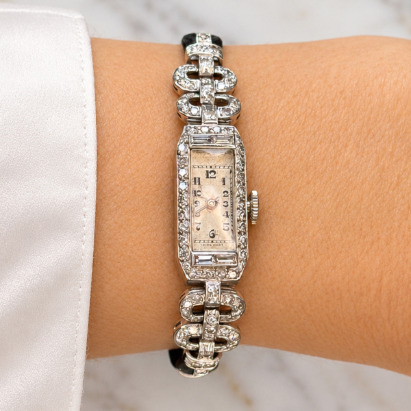 A model wearing an antique Art Deco diamond watch in 9ct white gold,