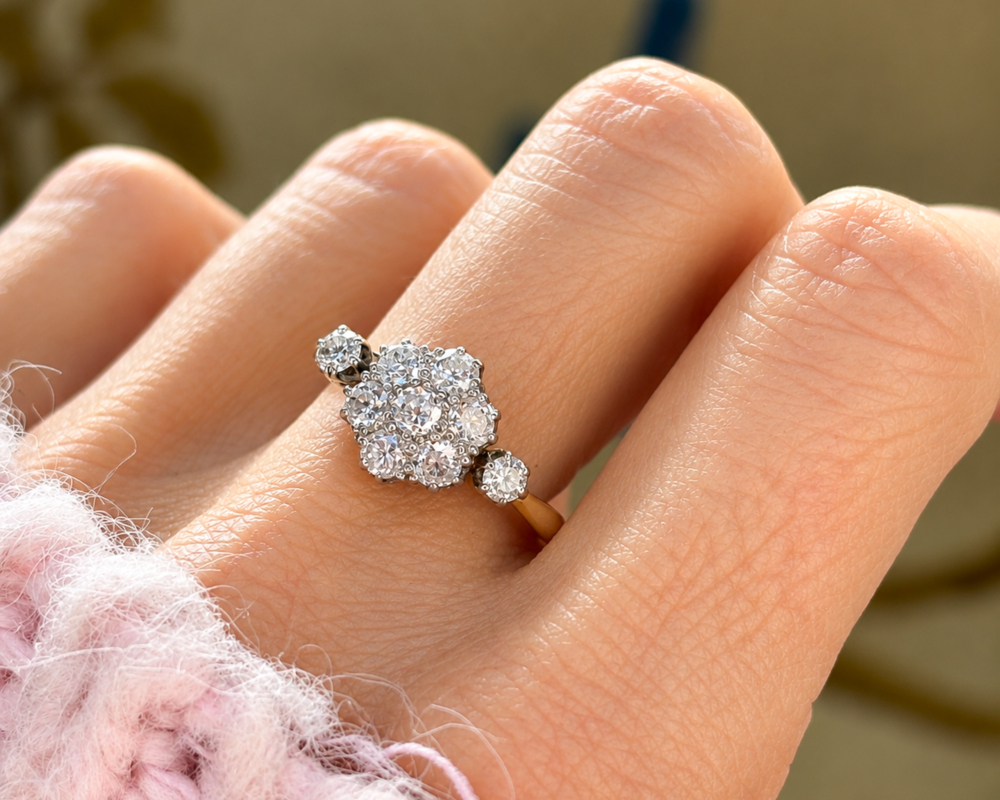 antique diamond daisy cluster ring 1ct in 18ct yellow gold and platinum for sale in Leeds, shown on a model's hand