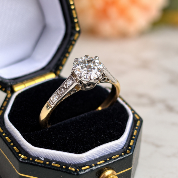 antique Art Deco diamond solitaire with diamond shoulders in 18ct yellow gold and platinum 0.7ct for sale in Leeds, shown in a black ring box