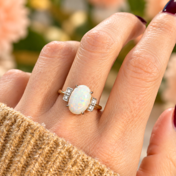 antique Art Deco opal and diamond ring in 9ct gold for sale in Leeds shown on a woman's hand