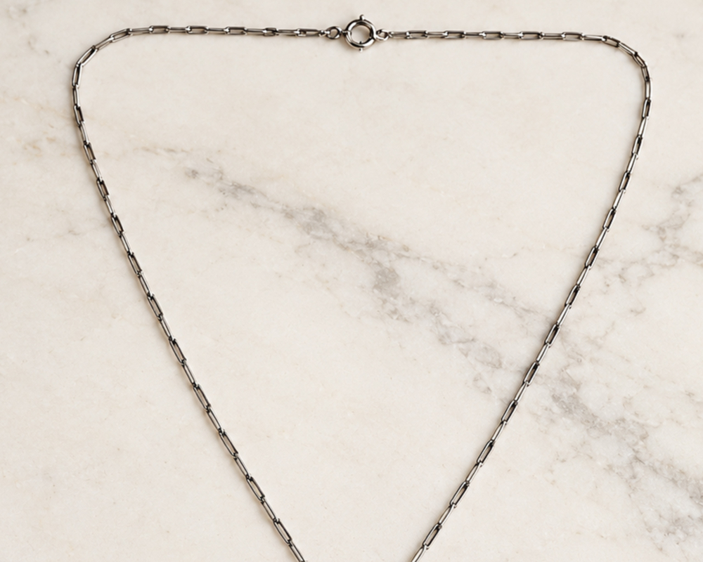 The integral chain on an antique Edwardian old cut diamond necklace in platinum,