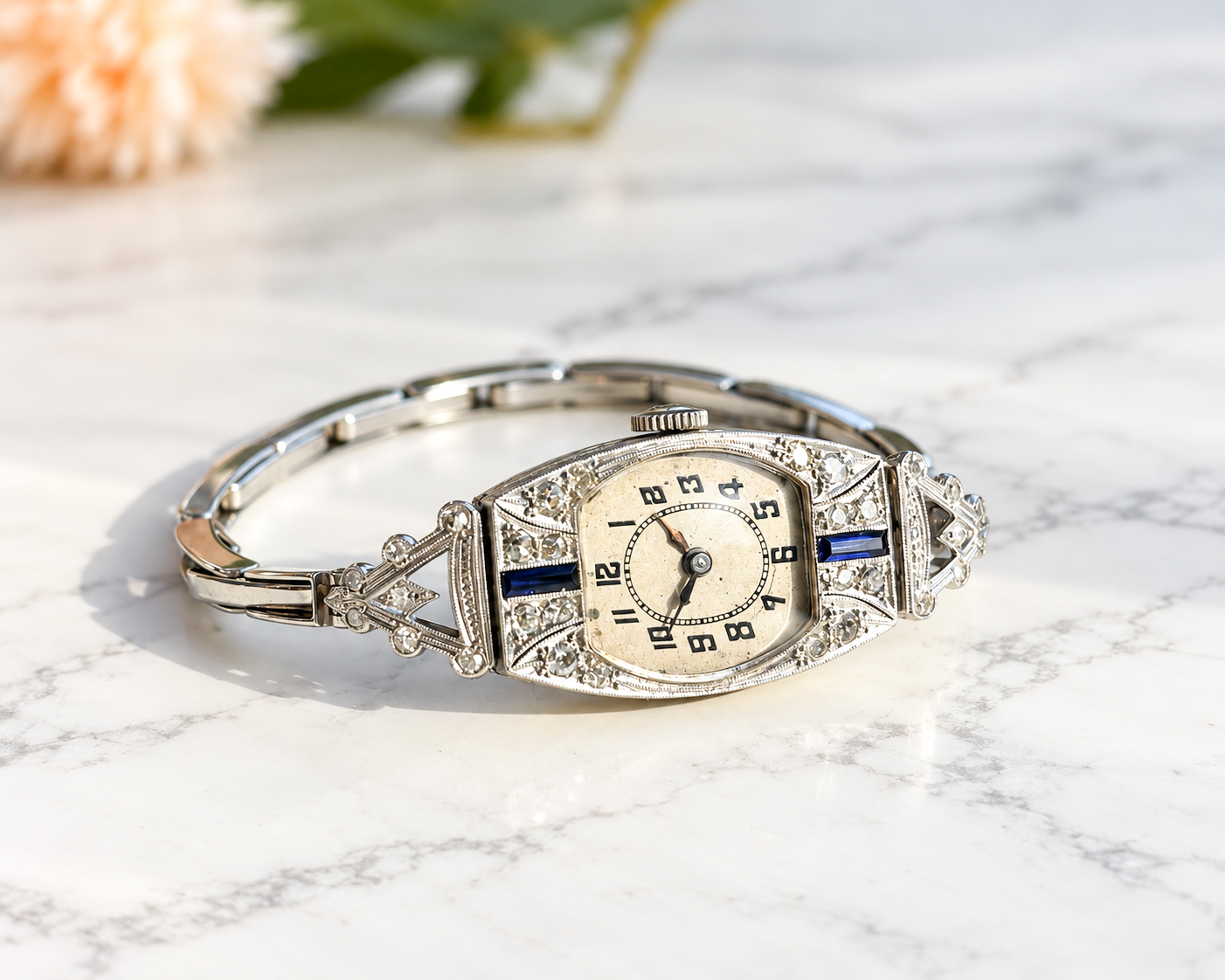 antique Art Deco diamond cocktail watch set with sapphires in platinum with a 9ct white gold strap. For sale in Leeds